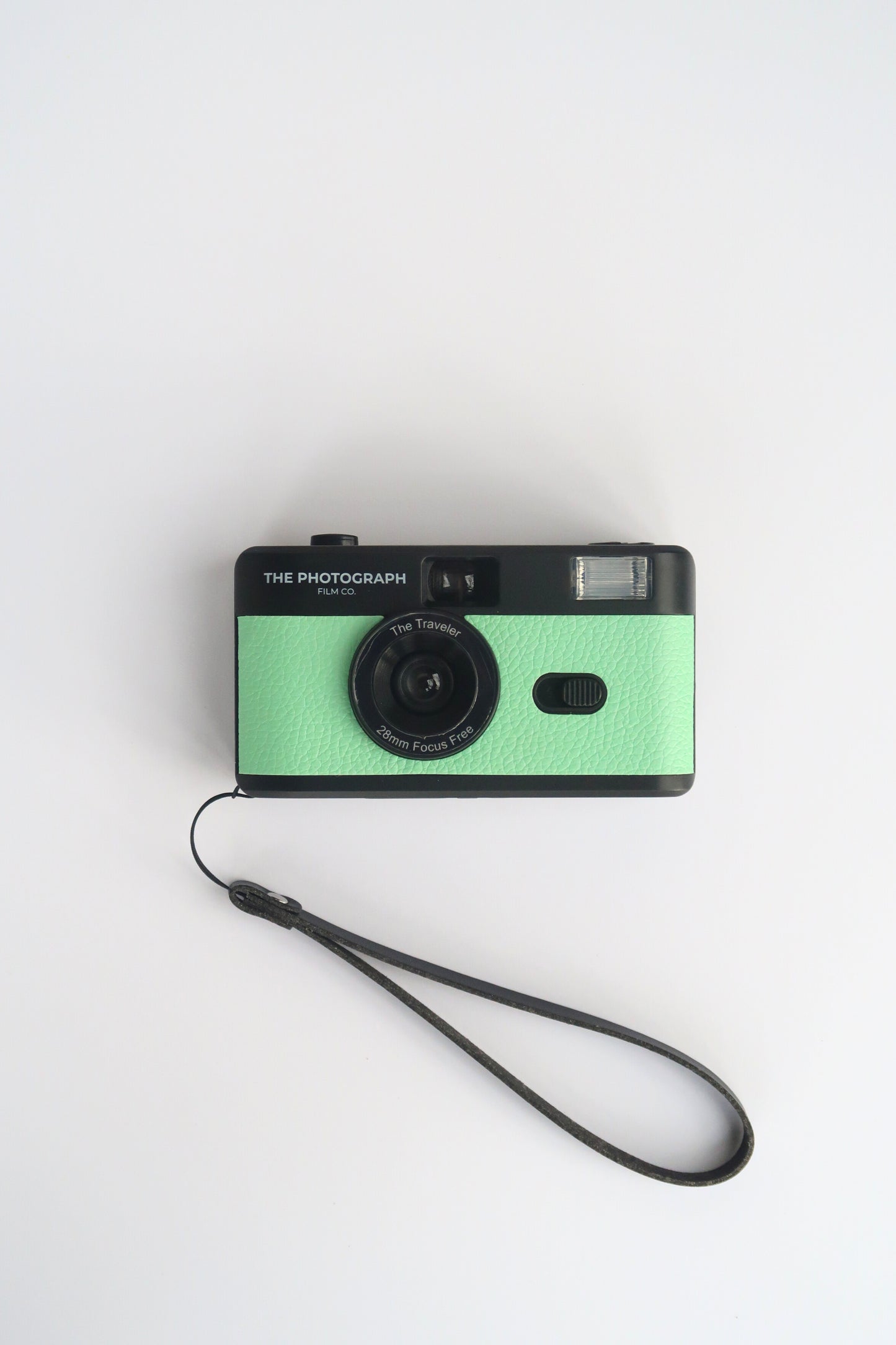 The Traveler Green Reusable Film Camera on a travel adventure, compact and eco-friendly 35mm film camera.